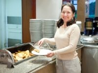 Woman takes fresh crouton